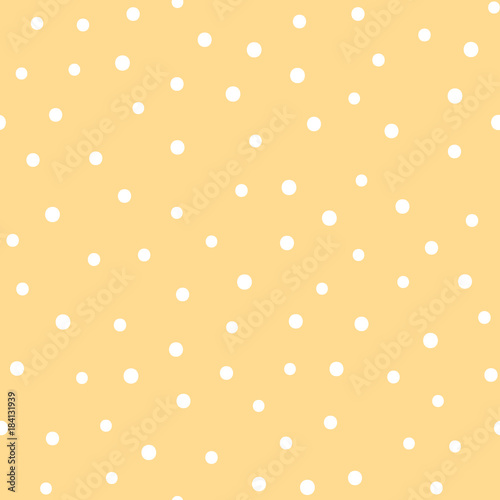 Vector seamless pattern with dots. Nice yellow background with white rounds. Pastel color design for babies.