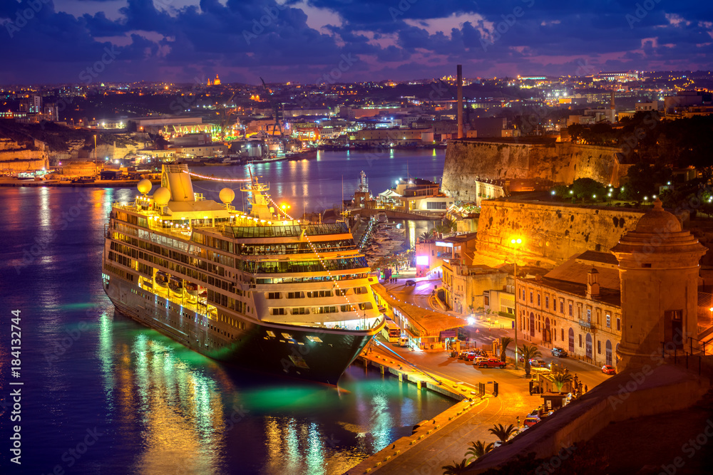 aerial view of cruise ship in Grand Harbour in night, Valletta, Malta