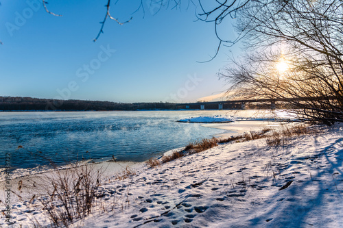 Winter sun over the Bureya   Ice-free in winter  near hydroelectric power station  Bureya river