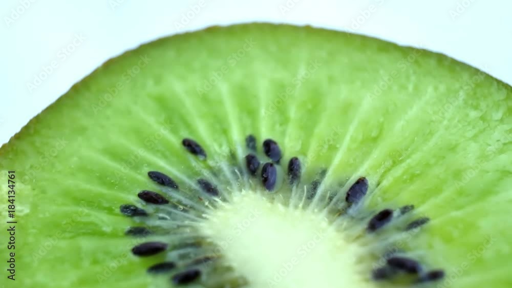 Juicy kiwi rotates as background. Slice of fresh kiwi fruit isolated on white background Juicy kiwi rotates as background. Slice of fresh kiwi fruit isolated on white background