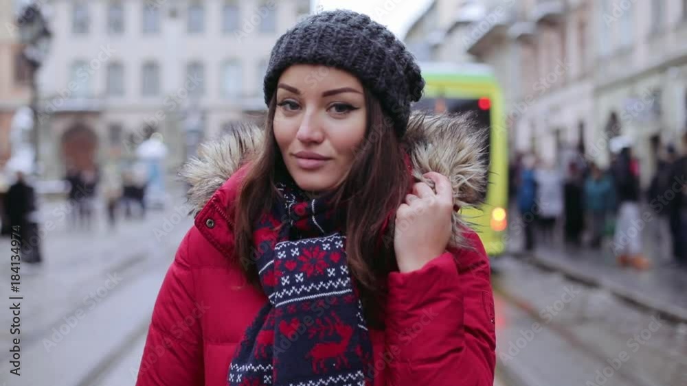 Close up face beautiful young woman with charming smile returns looking camera happiness holiday lifestyle snowflakes cold snow white beauty face winter attractive slow motion Close up face beautiful young woman with charming smile returns looking camera happiness holiday lifestyle snowflakes cold snow white beauty face winter attractive slow motion