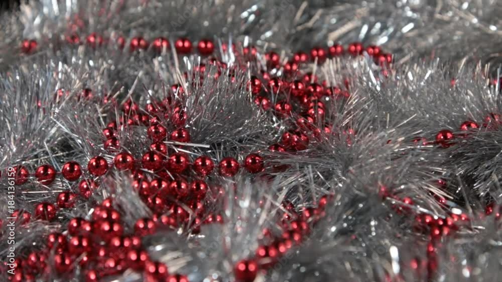 Rotation of red beads and silvery tinsel. Rotation of red beads and silvery tinsel.