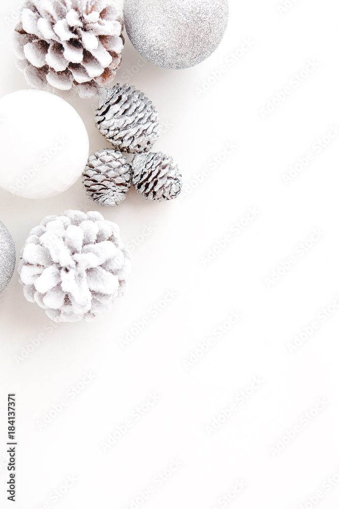 White Christmas background from above. Frosty pine cones, white and silver  colored decoration balls. Minimalist style. Copyspace for text, vertical  Stock Photo | Adobe Stock