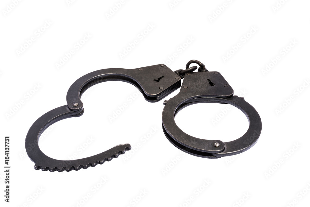 black metal handcuffs with small scratches on white background black metal handcuffs with small scratches on white background