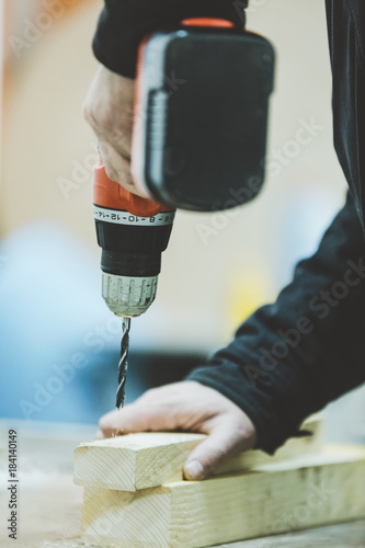 Senior craftsman working on woodwork