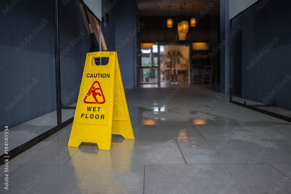 Wet floor caution sign. - obrazy, fototapety, plakaty 