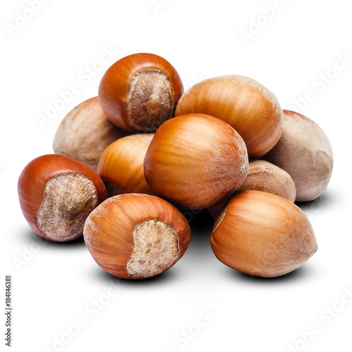 heap of hazelnuts close-up isolated on white background. Clipping path