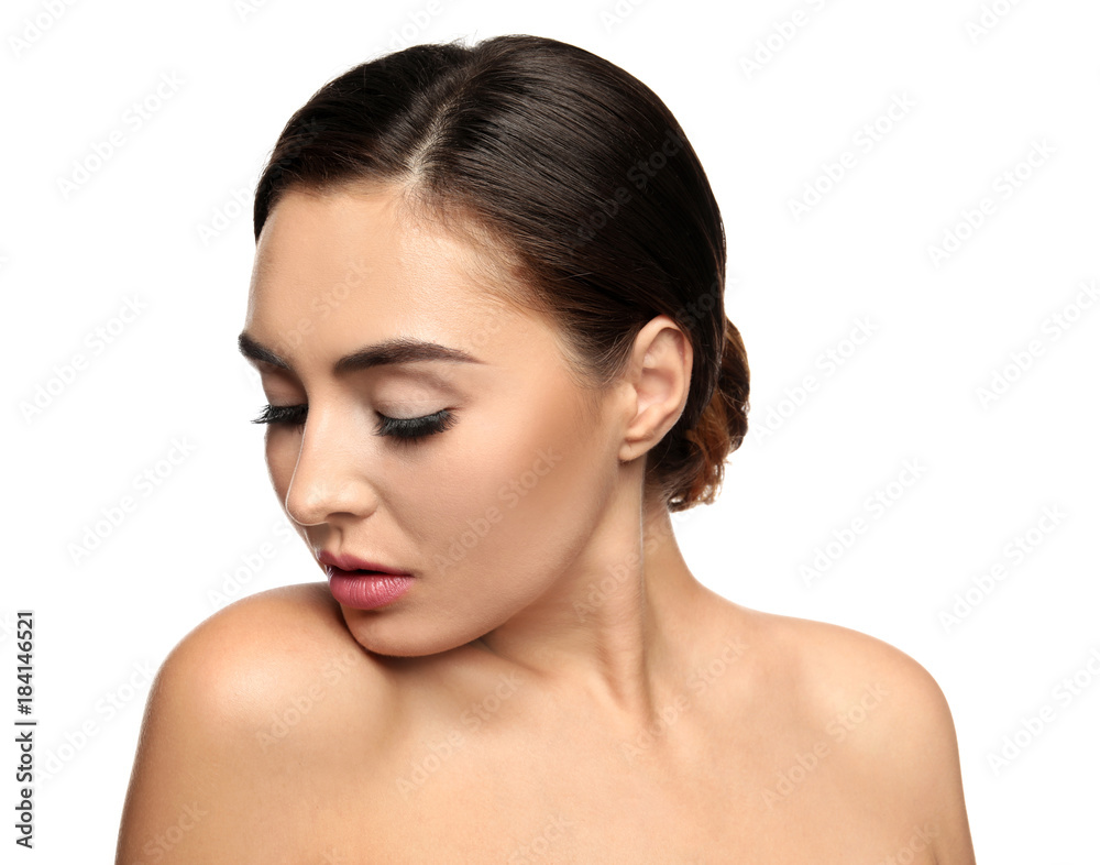 Portrait of beautiful young woman with eyelash extensions on white background