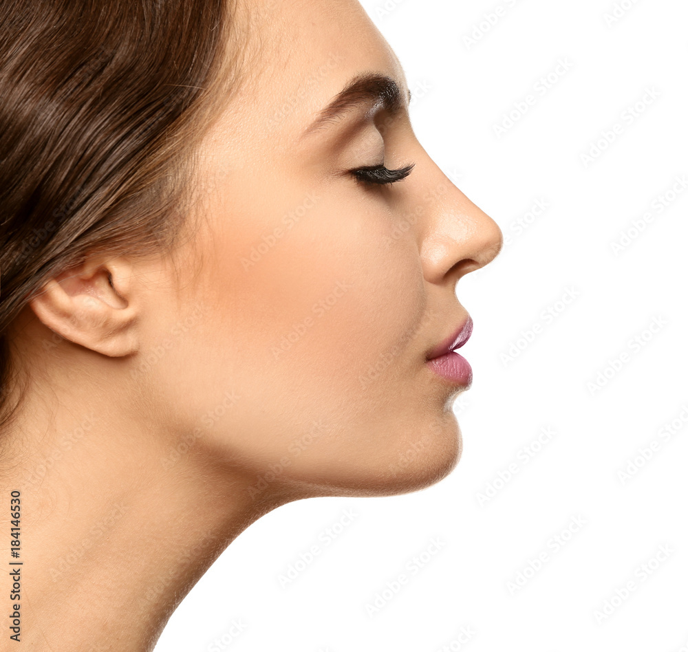 Portrait of beautiful young woman with eyelash extensions on white background Portrait of beautiful young woman with eyelash extensions on white background