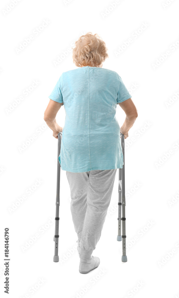 Elderly woman with walking frame on white background