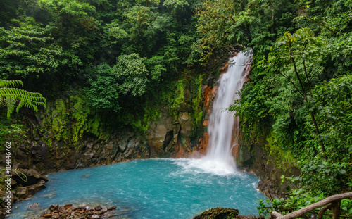 Celestial blue waterfall and pond in tenorio national park