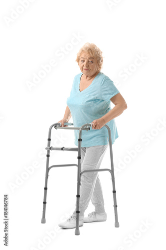 Elderly woman with walking ...