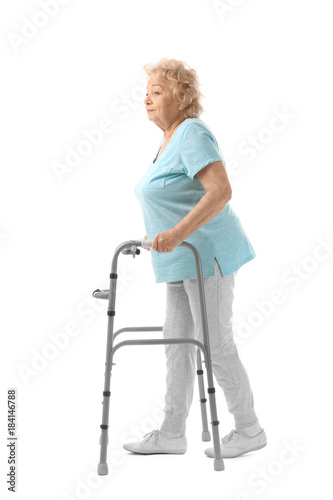 Elderly woman with walking ...