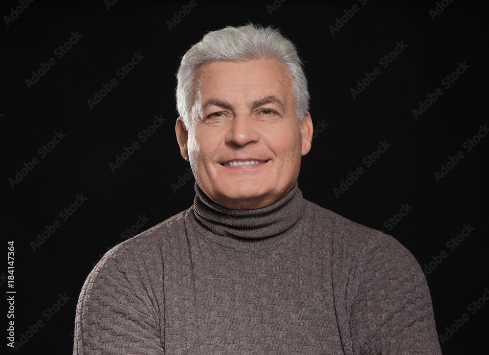 Handsome senior man in casual clothes on black background Handsome senior man in casual clothes on black background