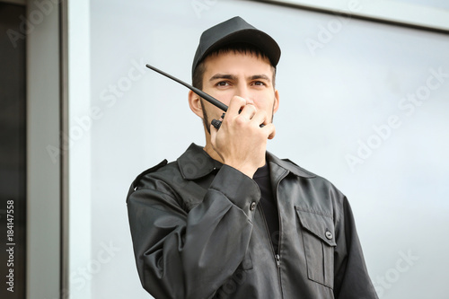 Male security guard using p...