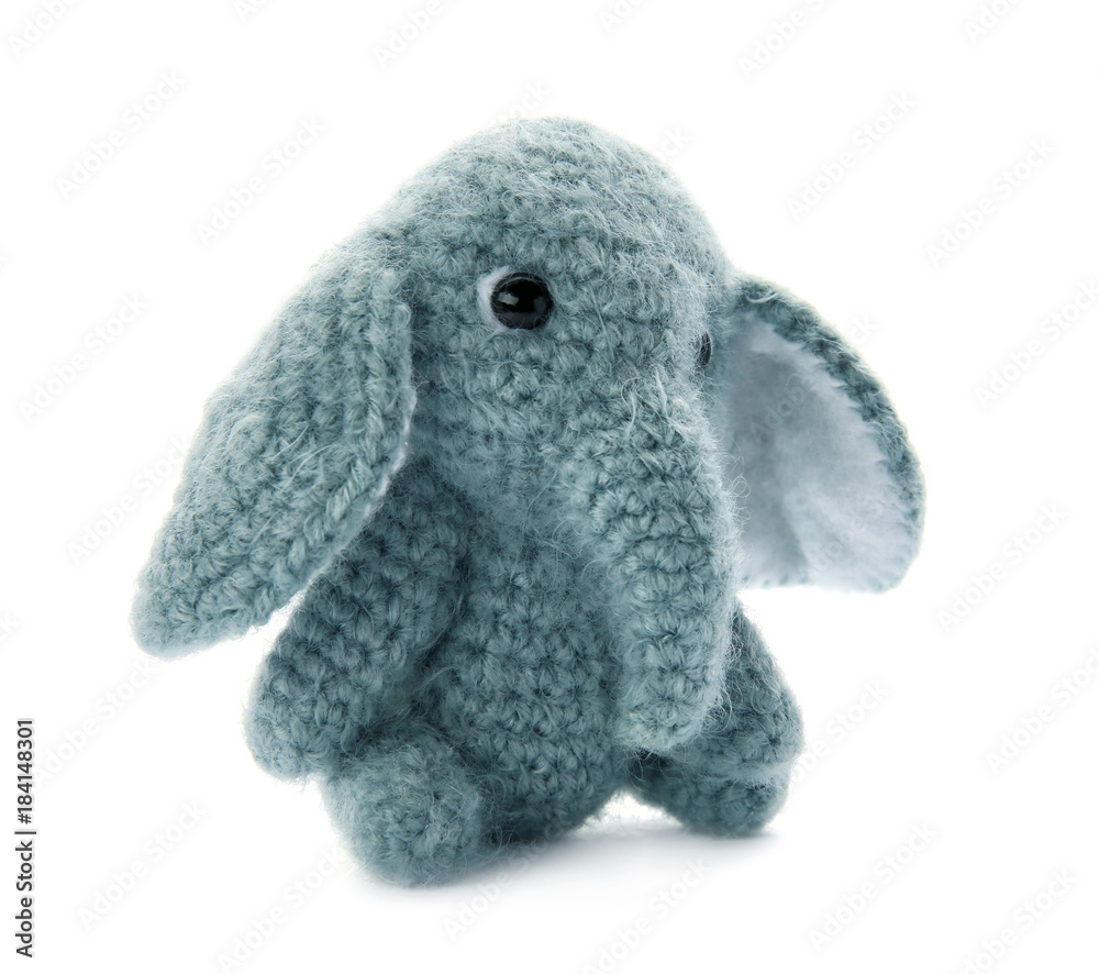 Cute knitted toy elephant on white background Cute knitted toy elephant on white background