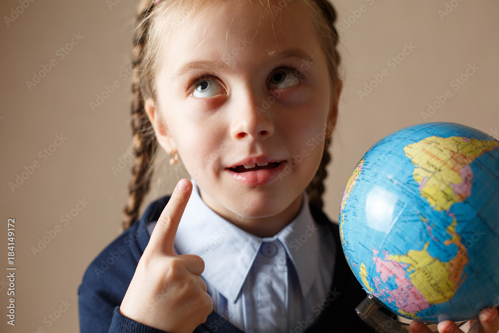 Cute kid with globe.