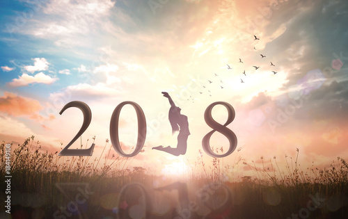 Happy New Year concept: Alone woman and text for 2018 over sunrise background.