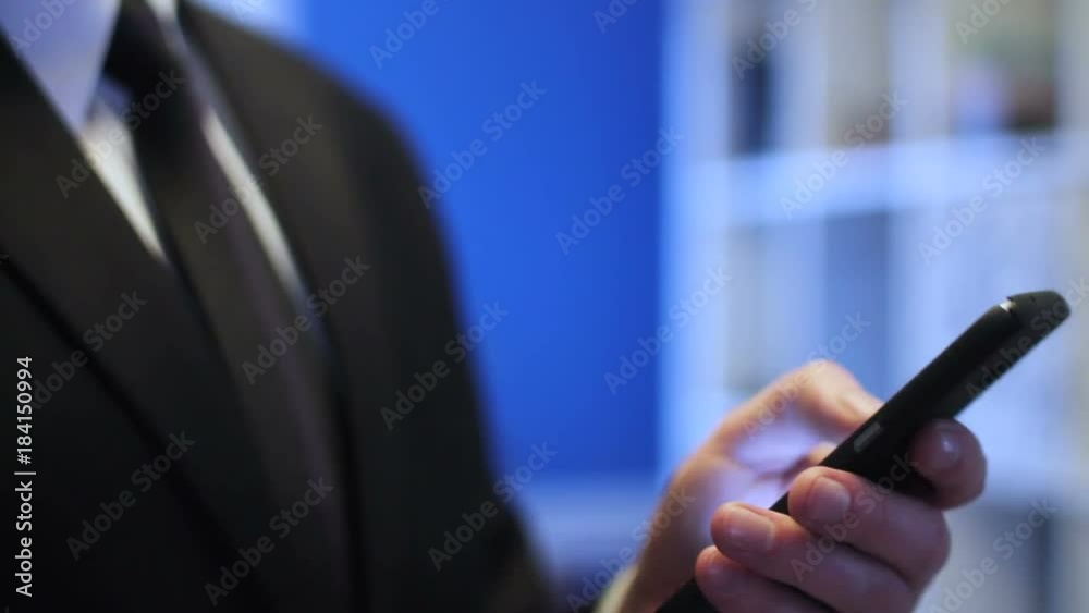 Businessman using smartphone in office Businessman using smartphone in office
