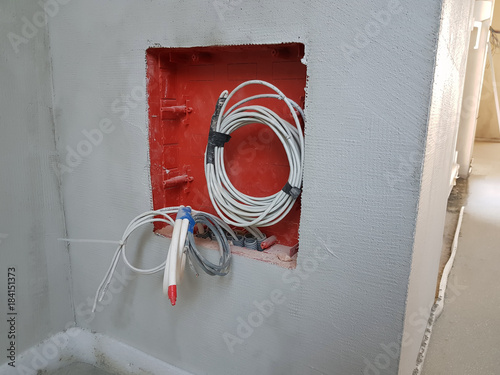 New home construction showing drywall with electrical boxes