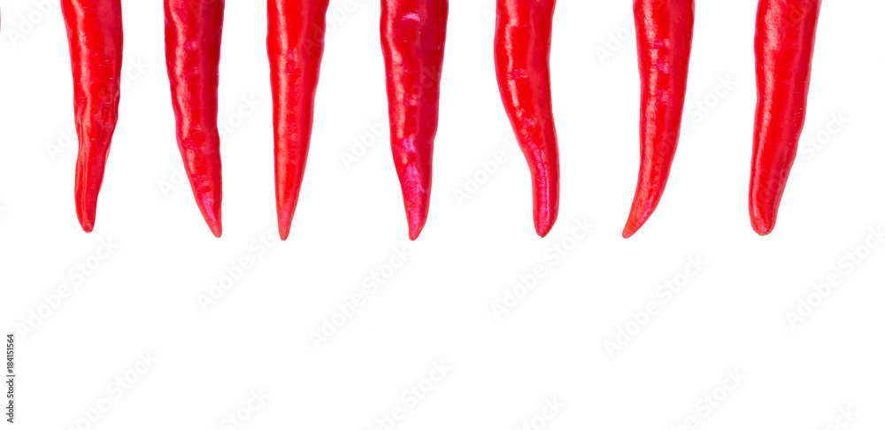red hot chili peppers, popular spices concept - decorative arrangement of seven colorful pods of chili on isolated background, top view, flat lay, free space for text red hot chili peppers, popular spices concept - decorative arrangement of seven colorful pods of chili on isolated background, top view, flat lay, free space for text