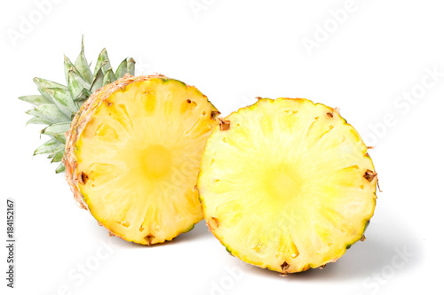 Two halves of a ripe pineapple on a white