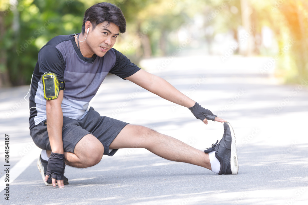 Fitness sport young man running in the park.Healthy concept Fitness sport young man running in the park.Healthy concept