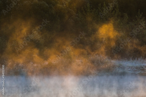 Image of morning mist over the surface of water 