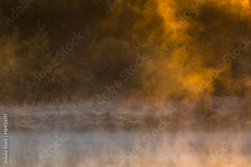 Image of morning mist over the surface of water © lukjonis