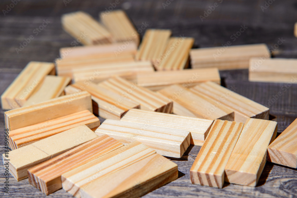 scattered wooden sticks from jenga scattered wooden sticks from jenga