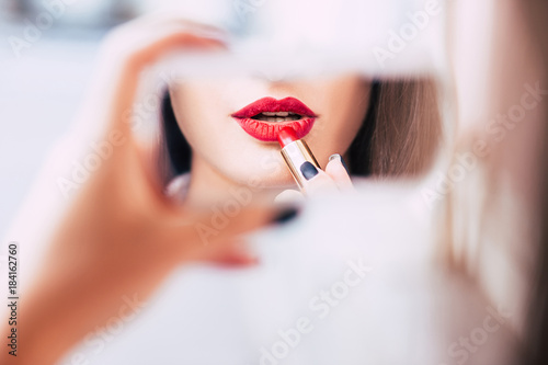 red lipstick makeup seductive sensual provocative sexy woman lips concept photo