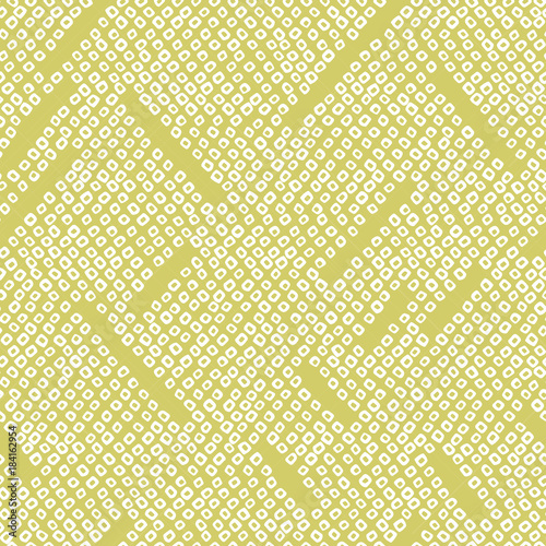 Abstract seamless pattern. Japanese Shibori motif. Geometric background. Classic japanese dyeing technique. Bright yellow asian backdrop. For wallpaper, decoration or printing on fabric.