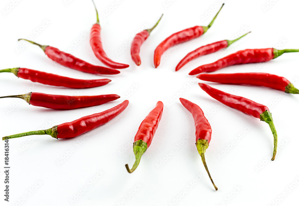 circle folded pepper pepper red chili with green tails, bright vegetable on a white background circle folded pepper pepper red chili with green tails, bright vegetable on a white background