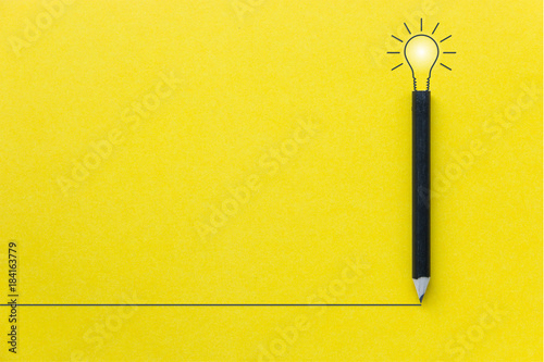 Black pencil on yellow backgroud with light bulb illustration line and copyspace for Inspiration and Creative concept