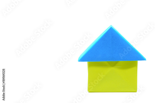 Paper house origami on whit...
