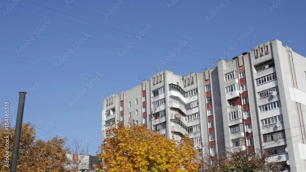autumn houses in the city,apartment buildings and trees are autumn yellow
