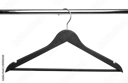 Black Wooden clothes hanger on metal crossbar isolated over white.
