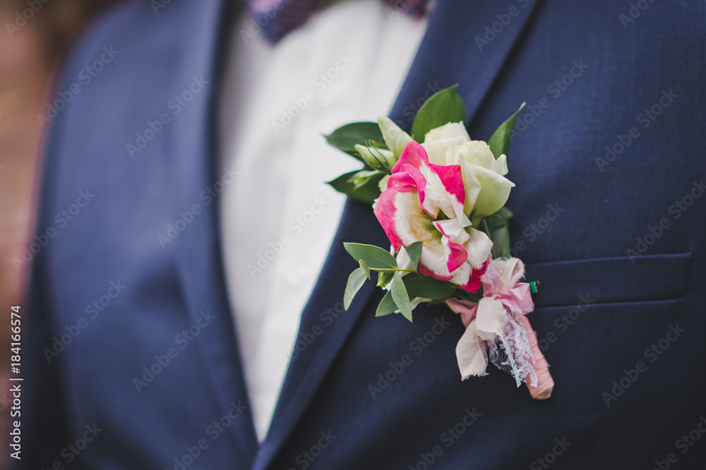 A boutonniere on the lapel of the groom 9654. A boutonniere on the lapel of the groom 9654.