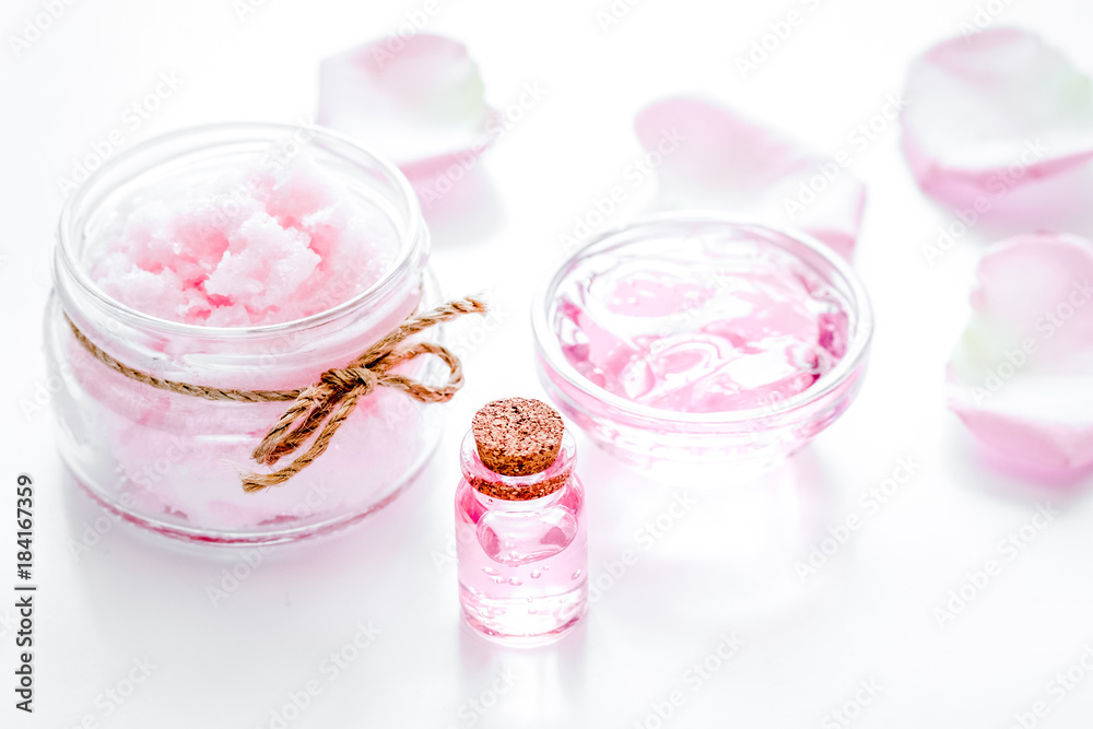 rose organic cosmetics with salt, cream and oil on white table b