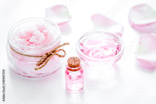 rose organic cosmetics with salt, cream and oil on white table b