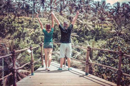 Young romantic honeymoon couple in the jungle rainforest of a tropical island of Bali, Indonesia.