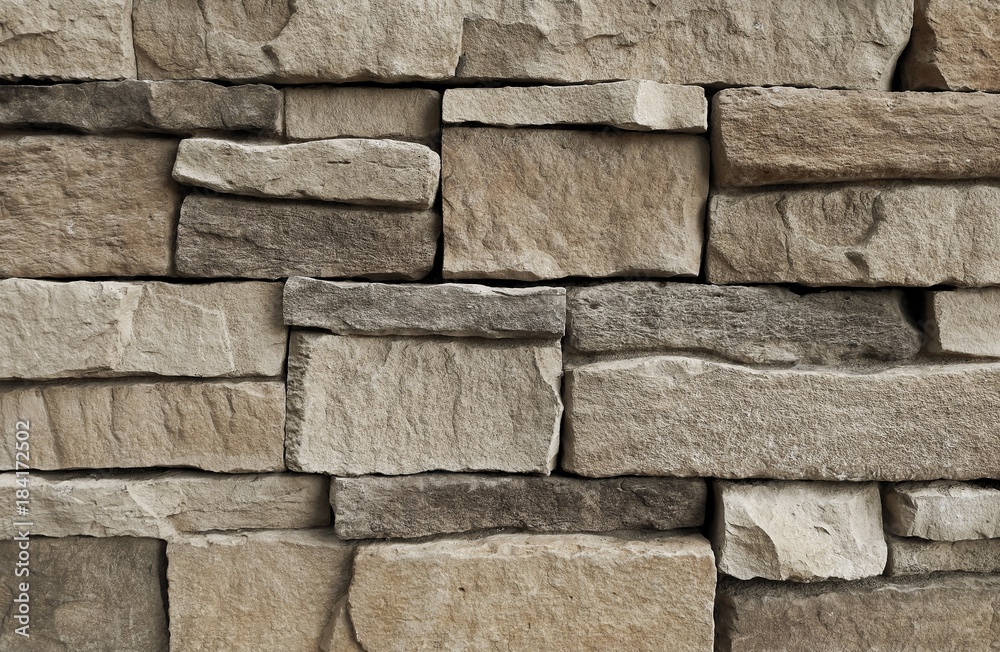 Fototapeta premium Horizontal Texture of Brown Asymmetrical Stones Wall