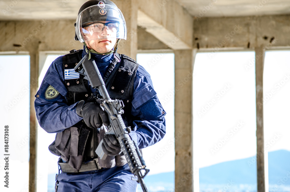 Police special forces, blue uniform and protection helmet Stock Photo |  Adobe Stock