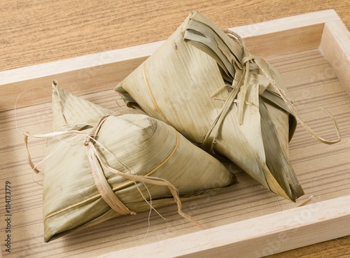 Zongzi or Sticky Rice Dumpling on Wooden Tray