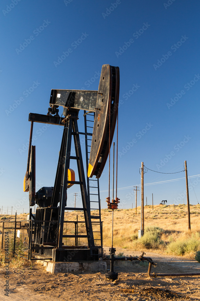 Fototapeta premium Working oil pump in desert, USA
