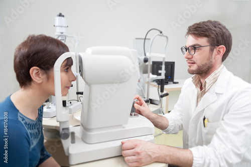 Young woman during an eye exam with the ophthalmologist