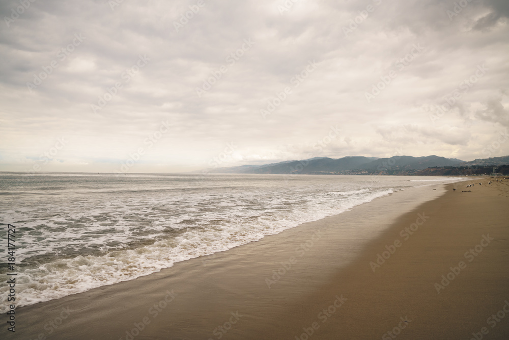 ocean waves on Santa Monica beach in cloudy november day ocean waves on Santa Monica beach in cloudy november day