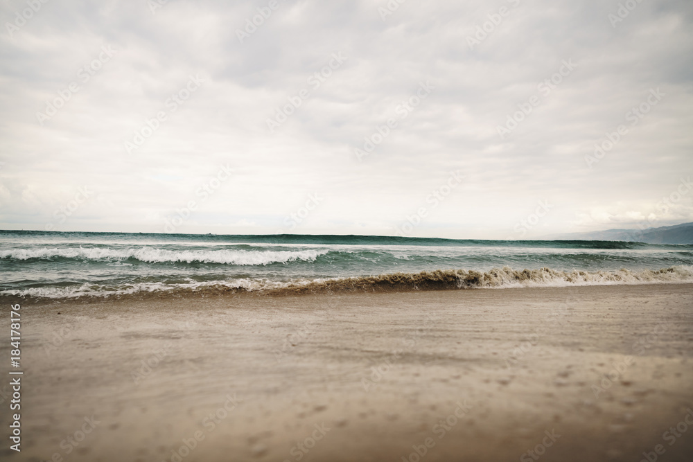 ocean waves on Santa Monica beach in cloudy november day ocean waves on Santa Monica beach in cloudy november day