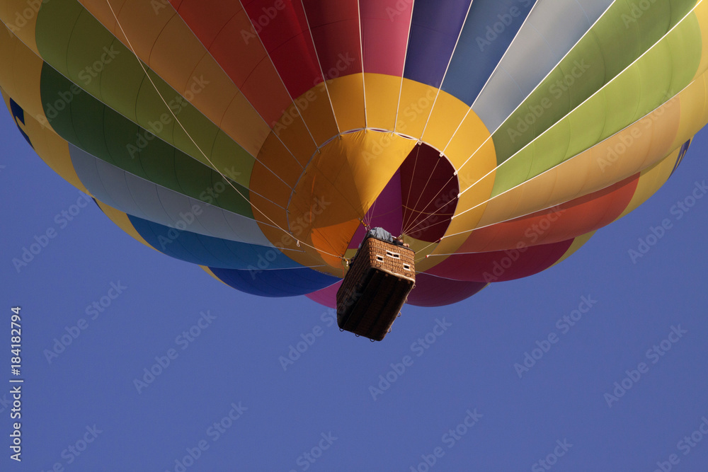 Obraz premium Hot air Balloon. Floating free in the sun light on a blue sky