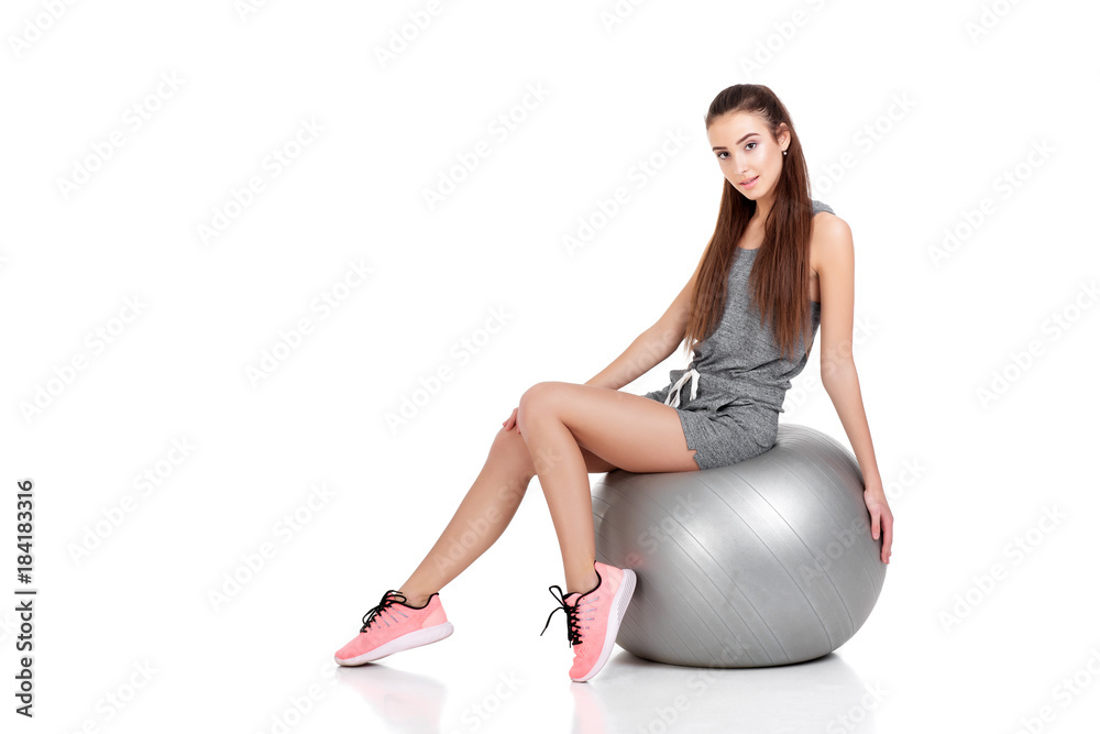 woman in sports clothes with fitness ball woman in sports clothes with fitness ball